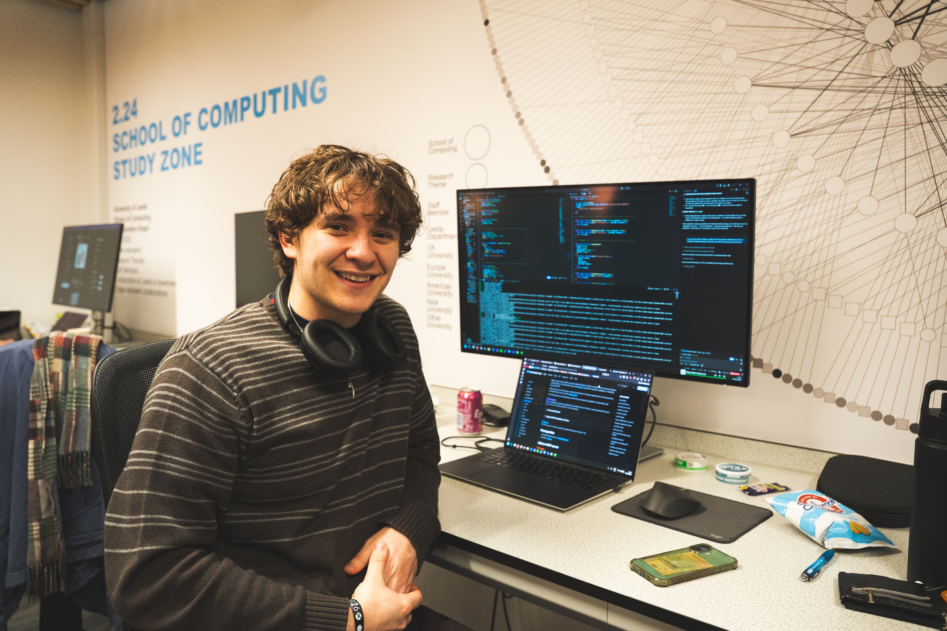 Attendees showing their work to a judge at LeedsHack 2025